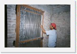 Jose leveling the door * These guys do quality work!
Honestly, we're really blessed, because the people we're working with really do quality work. Here's Jose (known as Cheche) making sure that the door that we're installing is perfectly level. * 672 x 448 * (124KB)