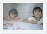 Pikis and Abi * Pikis (her real name is Margarita) is Beto and Meche's youngest daughter. In this photo she's doing the coloring activity with her friend Abi. * 1633 x 1126 * (632KB)
